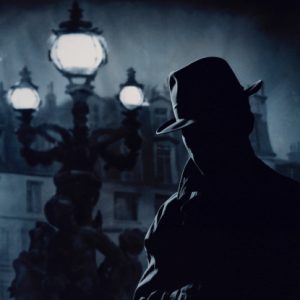 SILHOUETTE OF A DETECTIVE OUT AT NIGHT